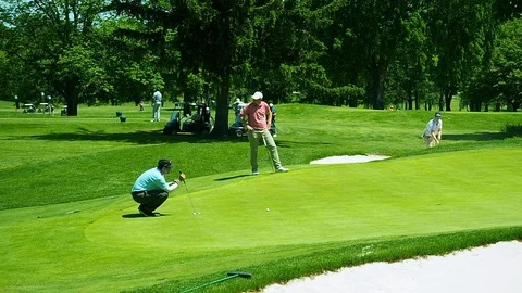 Golfer Putts Ball Into Cup Stock Footage 90524254