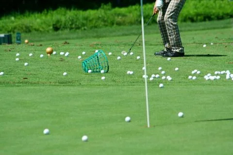 Golfer in retro pants practicing Stock Photos
