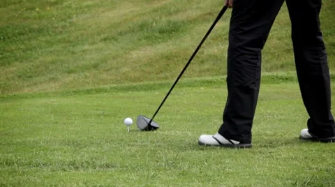 Golfer shooting a golf ball Stock Footage