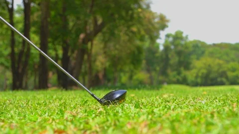 Golfer slow motion hitting golf ball in tee off zone to hole in one Stock-Footage 106858144