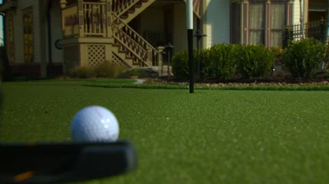 Golfer stroking golf ball into hole, Arkansas, USA Video stock 60690751