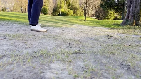 Golfer Successfully Hitting the Golf Ball on the Fairway without Grass Stockbeeldmateriaal 265165772