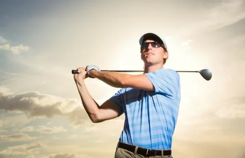 Golfer at sunset Stock Photos