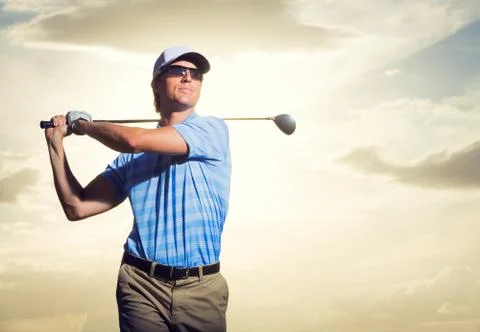 Golfer at sunset Stock Photos