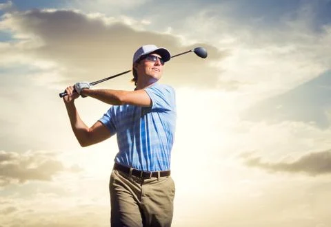 Golfer at sunset Stock Photos