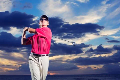 Golfer at sunset Stock Photos