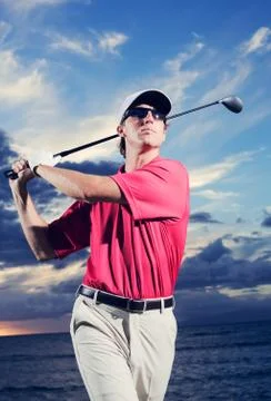 Golfer at sunset Stock Photos