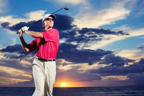 Golfer at sunset Stock Photos