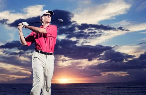 Golfer at sunset Stock Photos