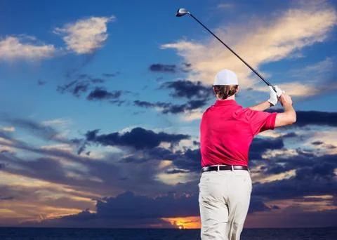 Golfer at sunset Stock Photos