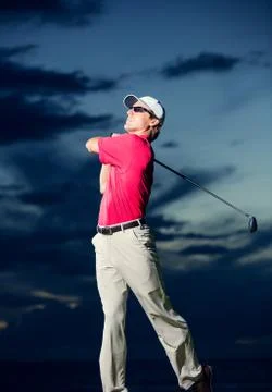 Golfer at sunset Stock Photos
