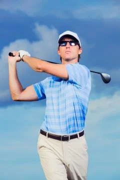 Golfer at sunset Stock Photos