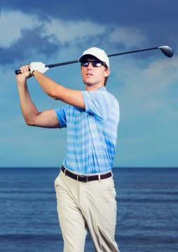 Golfer at sunset Stock Photos