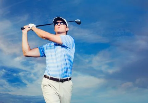 Golfer at sunset Stock Photos