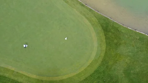 Golfer techniques on the fairway during afternoon play at local course Stock Footage 321469224