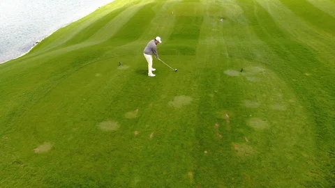 Golfer In Tee Box Driving Ball Aerial Follow Stock Footage 112896545