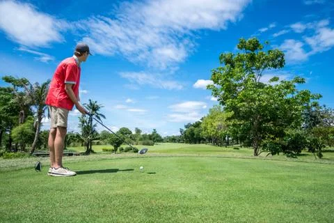 Golfer tee off Stock Photos
