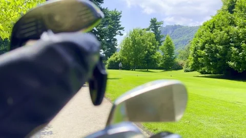 Golfer Teeing Off and Hitting with His Driver the Golf Ball on Golf Course Vídeos de archivo 245265380