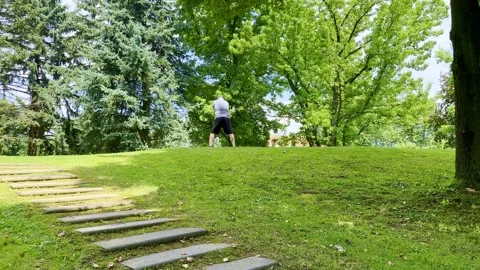 Golfer Teeing Off and Hitting with His Driver the Golf Ball on Golf Course Stockbeeldmateriaal 245265387