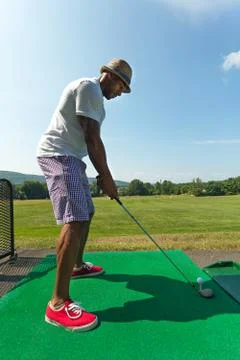 Golfer Teeing Up at the Driving Range Stock Photos