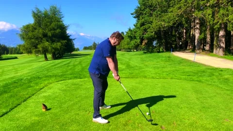 Golfer Teeing Off with Failure His 3 Wood on Golf Course with Mountain View Stock Footage 191951628