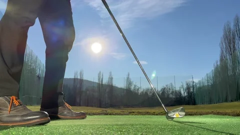 Golfer Training Golf Swing on Driving Range with Sunlight Vídeos de archivo 233579272