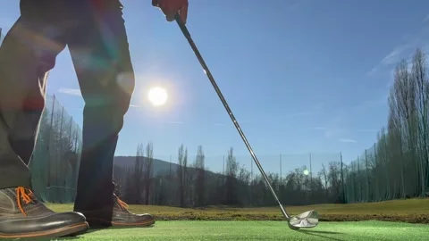 Golfer Training Golf Swing on Driving Range with Sunlight Vídeos de archivo 235984625