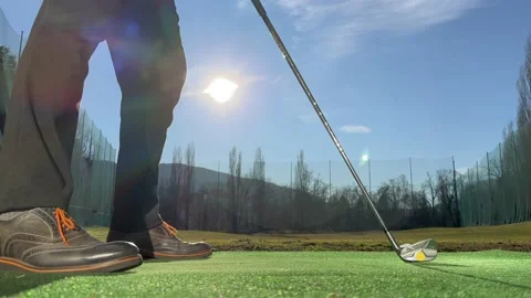 Golfer Training Golf Swing on Driving Range with Sunlight Stockbeeldmateriaal 236085861