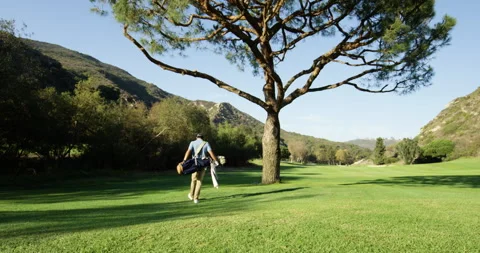 Golfer Walking the Course Stock Footage 262112493
