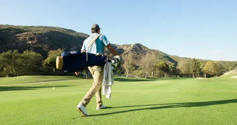 Golfer Walks the Course Stock Footage 262112454