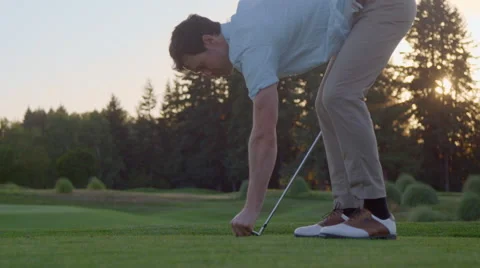 Golfer walks up to the tee box Stock Footage 60120632