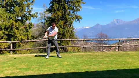 Golfer Warming Up with His Driver Stock Footage 112322088
