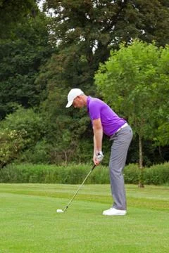 Golfer wedge shot Stock Photos