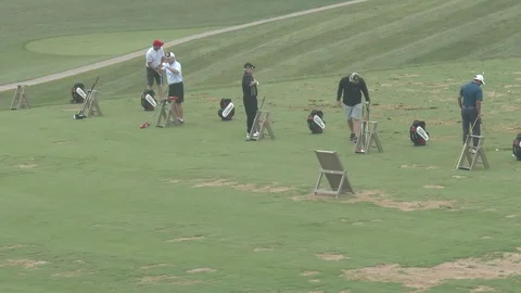 Golfers on Driving Range - Panning Shot Stock Footage 79513200