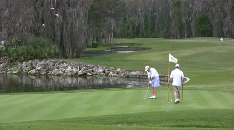 Golfers On Green Stock Footage 1061810