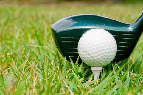 Golfing A driver just before it hits a golf ball. (License=RF) 2443901 Cop... Stock-Fotos