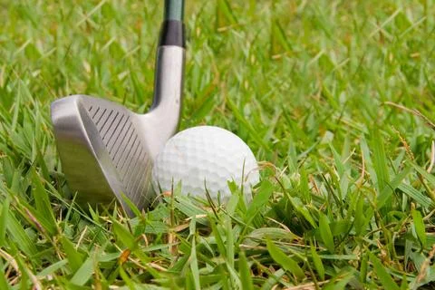 Golfing A driver just before it hits a golf ball. (License=RF) 2443899 Cop... Stock Photos