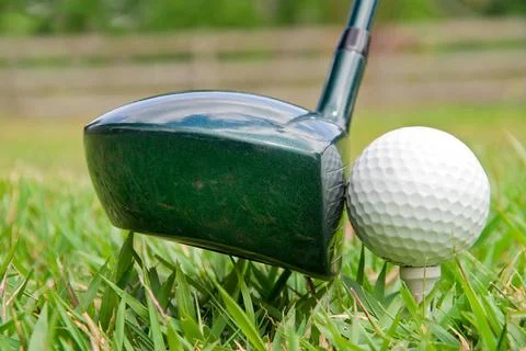 Golfing A driver just before it hits a golf ball. (License=RF) 2443931 Cop... Stock Photos
