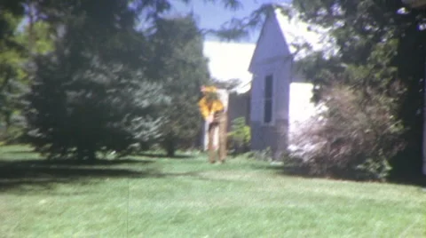 Golfing on Lawn Circa 1970 (Vintage Film 8mm Home Movie) Stock Footage