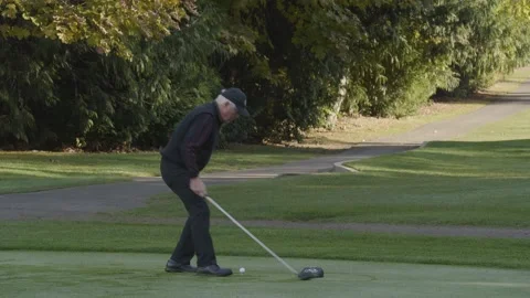 Golfing. A man hitting the ball. Stock Footage 142597706