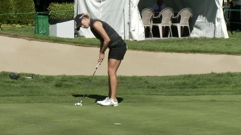 Golfing. Putting by professional golfer. Stockbeeldmateriaal 76780517