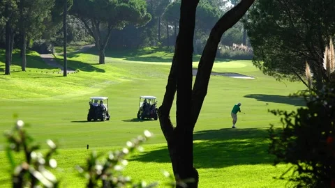 Golfing in Quinta do Lago Golf Course, Algarve, Portugal Stock Footage 149680924