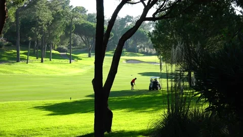 Golfing in Quinta do Lago Golf Course, Algarve, Portugal Stock Footage 149727902