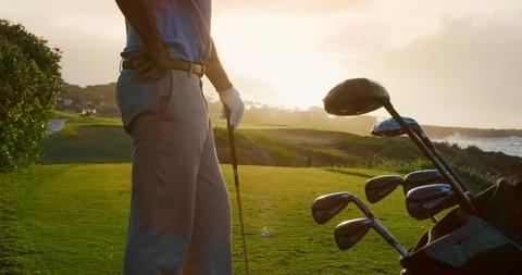 Golfing into the sunset Stockbeeldmateriaal 102409928