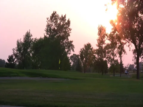 Golfing at twilight Stock Footage 34568763