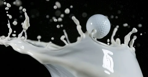 Golf's Ball and Exploding Milk against Black Background, slow motion 4K 動画素材 75968839