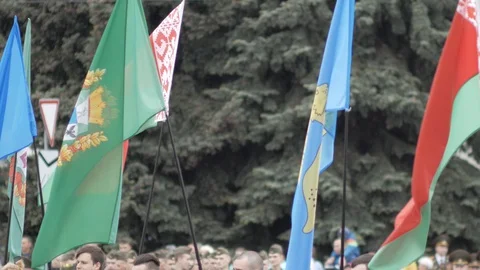 Gomel, Belarus - 09/05/2019: Festive flags waving in the wind at a parade Stock Footage 129737862