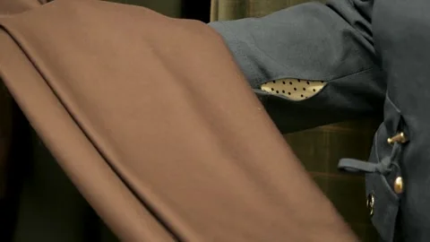 Gomel, Belarus - 11.16.2024: Tailor Feeling Quality of Brown Suit Fabric Swat Stock Footage 340261408