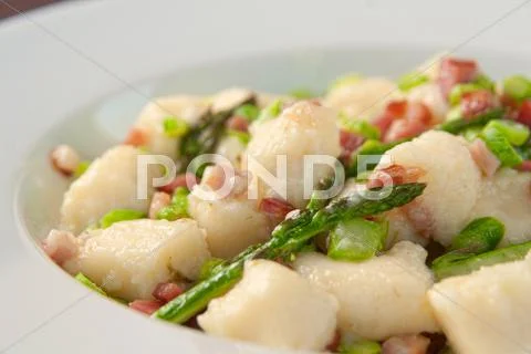 Goncchi with asparagus and bacon Stock Photos