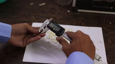 Gondal, India - 08/10/2024: manager testing food in different ways in lab Stock Footage 282952729